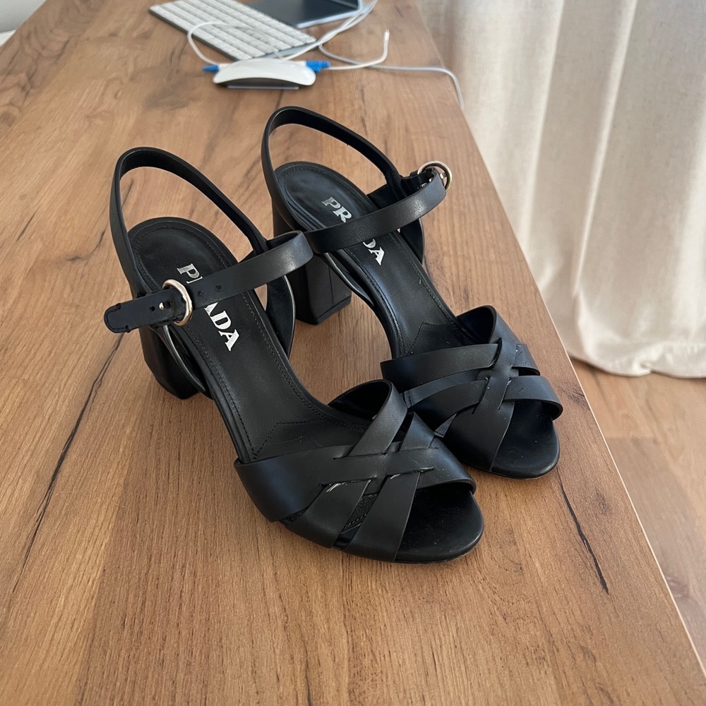 Prada thick heel sandals.